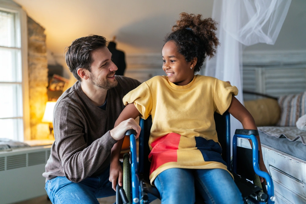 father with disabled daughter on wheelchair